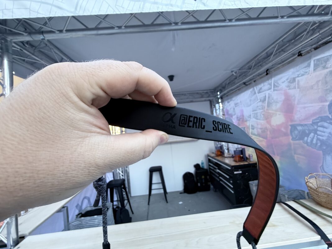 Wide view of a Merch Troop live printing booth built for guest flow