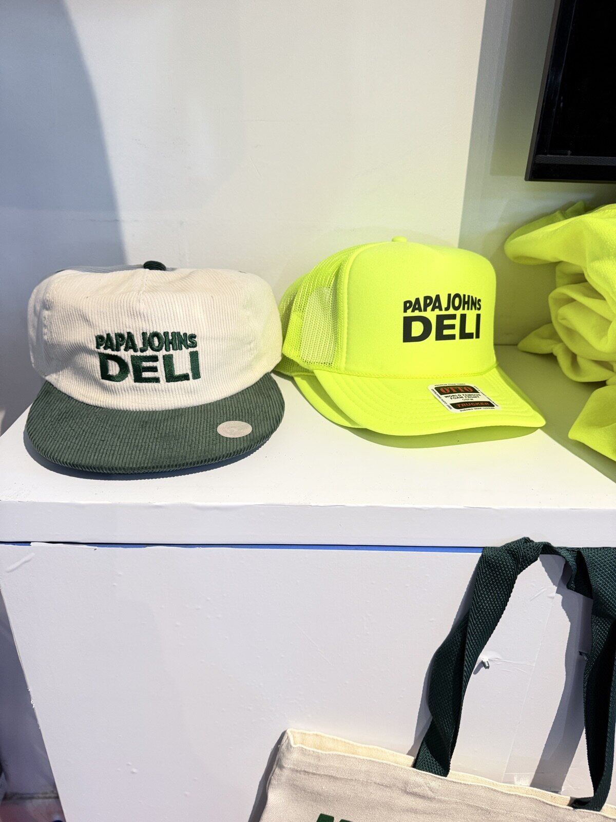 Branded merch and totes on display at an event